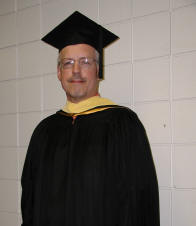 [Photo: Wayne in his professorial garb]